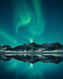 northern lights over mountains